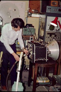 Jan King, K8GEY, gives the partially assembled AMSAT-OSCAR-8 a thorough cleaning n the basement of his home.