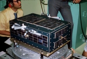 AMSAT-OSCAR 6 undergoes shake testing. Note the stowed "carpenter's rule" 10 Meter antenna.