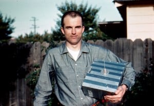 Lance Ginner, K6GSJ, poses with the flight model of Amateur Radio's first satellite....OSCAR-1.