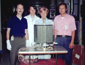 Members of the AO-7 project team pose with the fruits of their labor. From left are Dick Daniels, W4PUJ (SK); Jan King, W3GEY; "hired hand" Marie Marr and AMSAT Founding President Perry Klein, W3PK