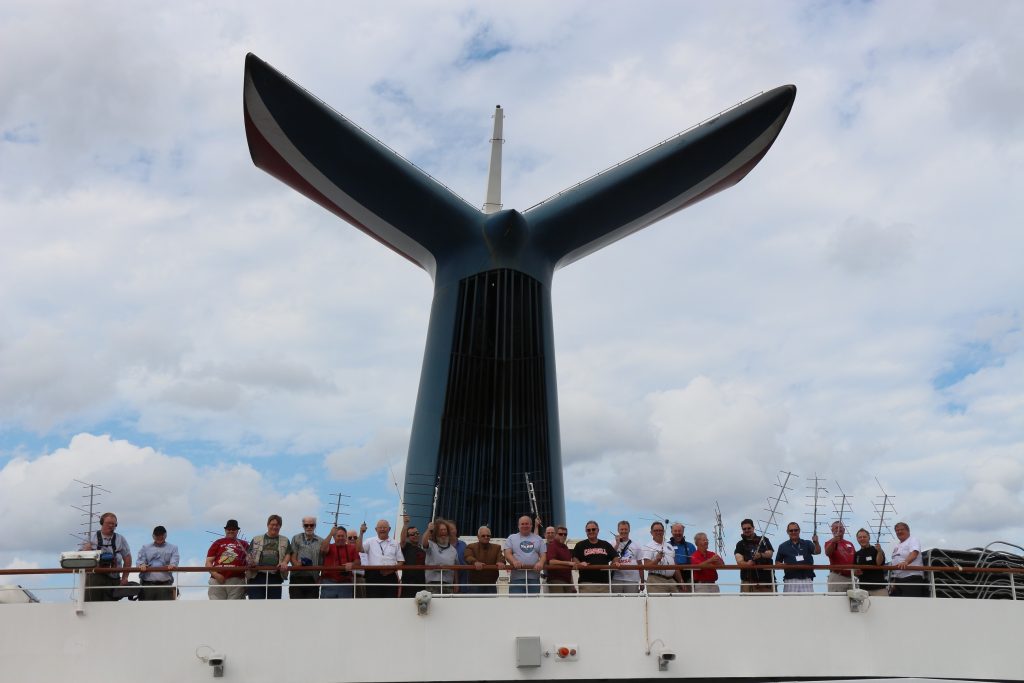 AMSAT members display their portable antennas from the aft deck of the Carnival Liberty during the 2016 AMSAT Space Symposium